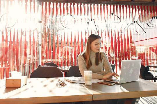 Business owner sat at computer doing paperwork